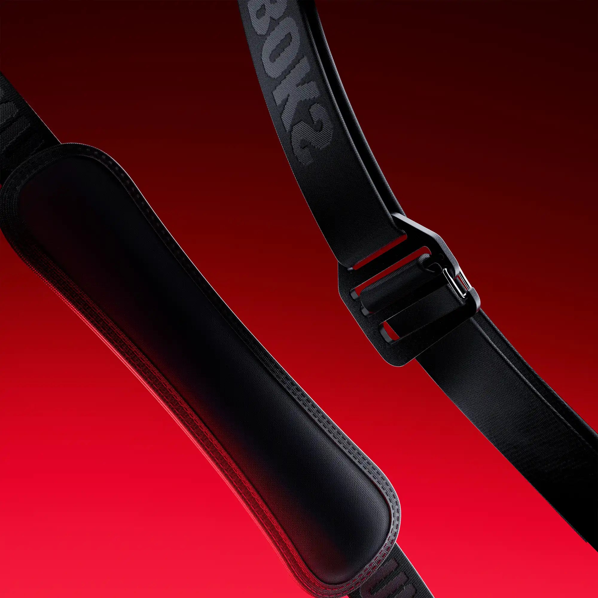 Close-up of The Strap 2.0 on red background
