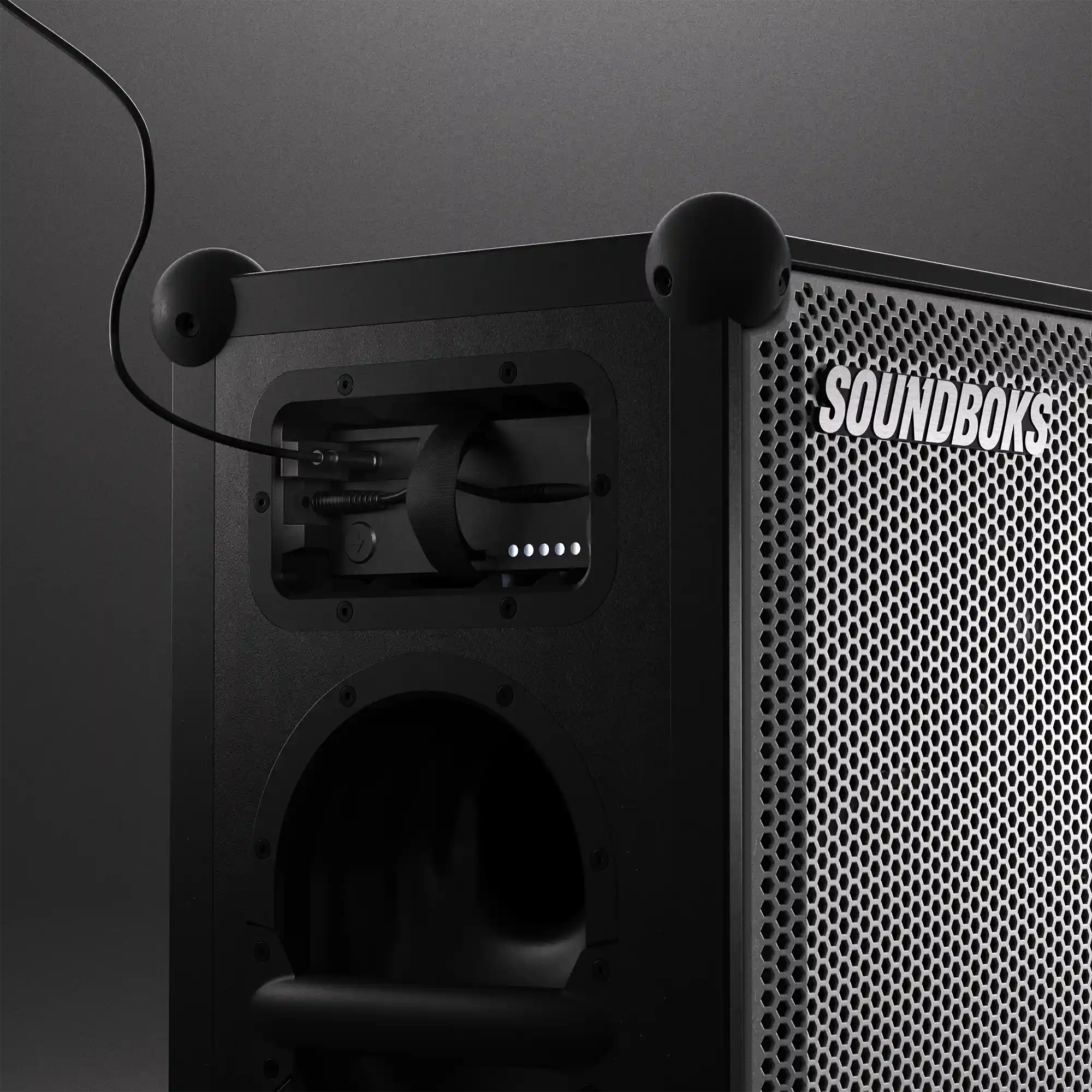 USB-C cable inserted in The Battery while playing on Metallic grey Soundboks 4